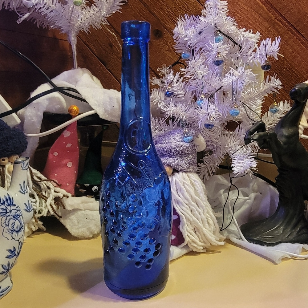 Cobalt Blue Vintage wine bottle with grapes